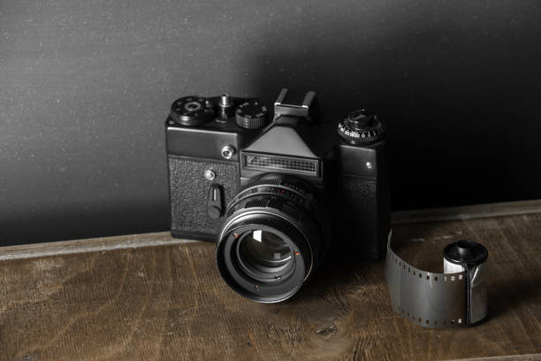 istock Old retro camera and 35 mm film 910314712