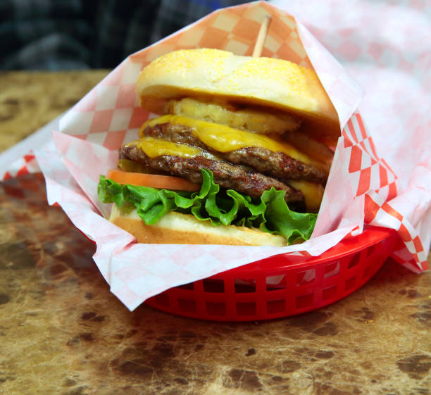 istock Double Hawaiian Cheeseburger on a Toasted Kaiser Roll with Pineapple 910314720