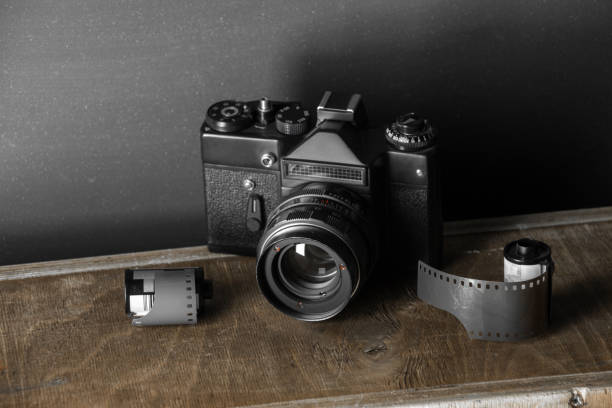 istock Old retro camera and 35 mm film 910314730