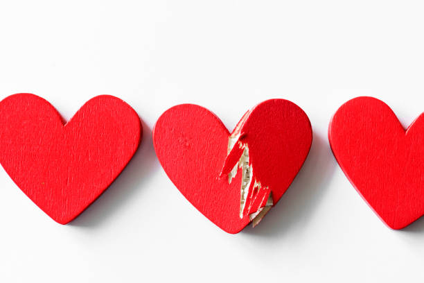 istock Closeup of red hearts on white background 910318818