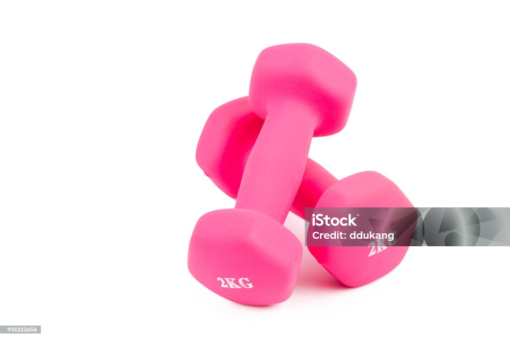 Close-Up Of Pink Dumbbells Pink weight training dumbbells on white Anaerobic Exercise Stock Photo