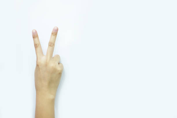 istock hand sign meaning number two, victory 910325190