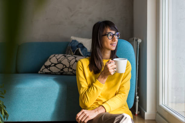 istock Woman having a break from work at home office 910325308