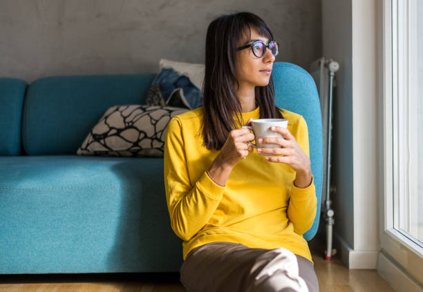 istock Woman having a break from work at home office 910325866
