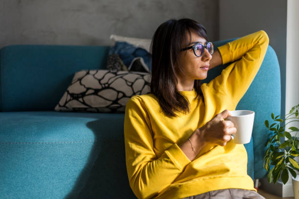 istock Woman having a break from work at home office 910326280
