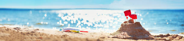 istock Sandcastle on the sea in summertime 910332426
