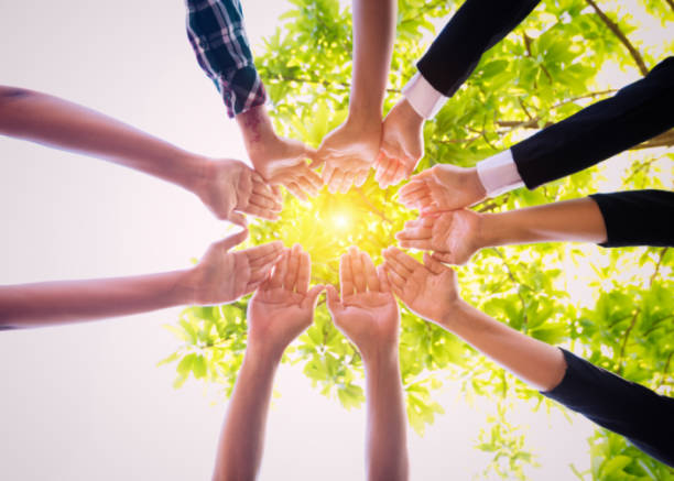 istock People putting their hands together. 910335766