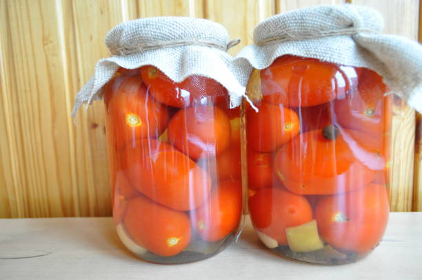 istock a group of cans with canned tomatoes and cucumbers 910335912