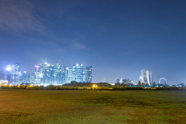 istock green grass land near modern buildings 910339238