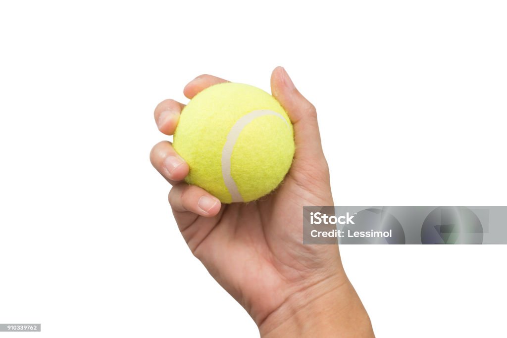 Hand holding tennis ball isolated on white background. Sports Ball Stock Photo