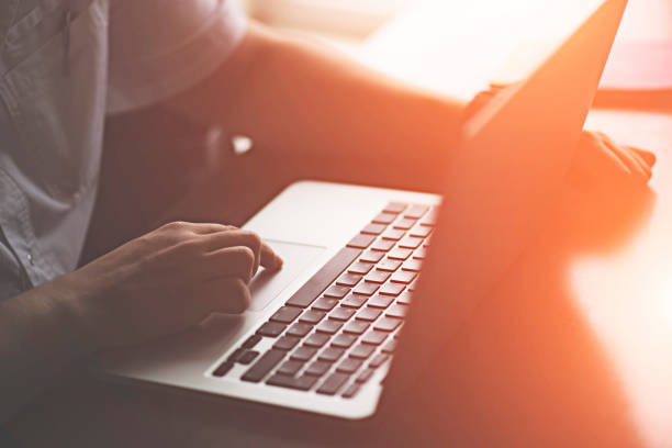 istock doctor working behind laptop 910339958