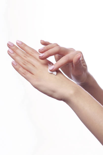 istock Cream on the women hand 910340138
