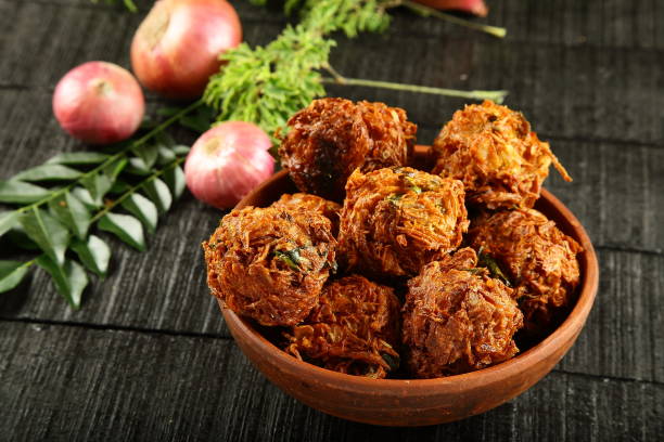 istock Popular Indian snack - spicy onion fritters. 910340144