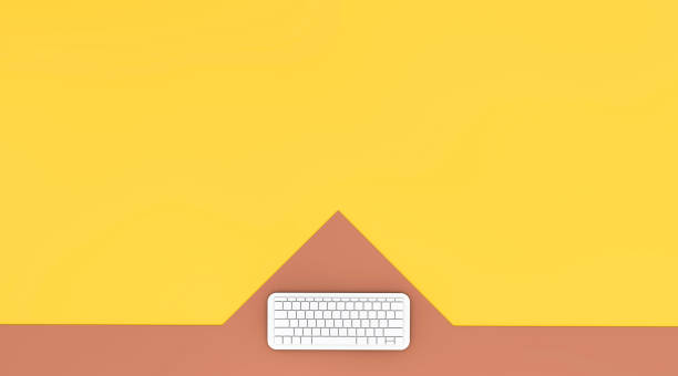 istock Aerial view of computer keyboard on colourful background 910354092