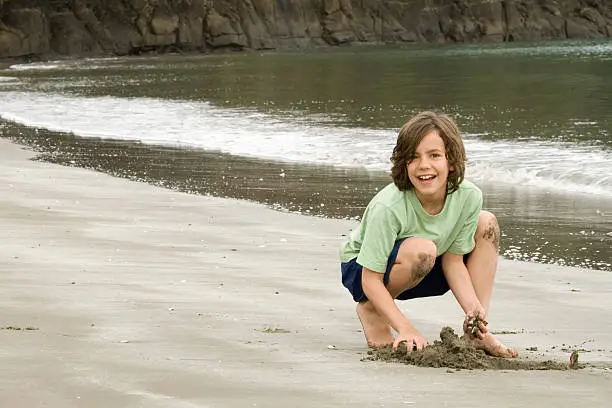 Photo of Boy playing on New Zealand Beach