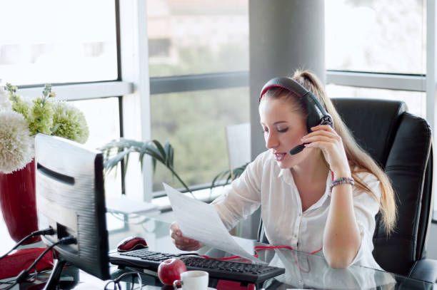 istock Female operator in the call center,  working in office. 910363110