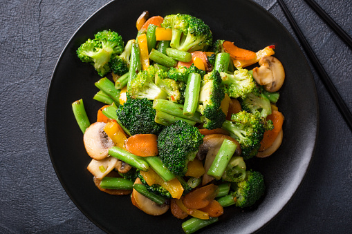 Mix of boiled vegetables, steam vegetables for dietary low-calorie diet. Broccoli, carrots, cauliflower, side view.