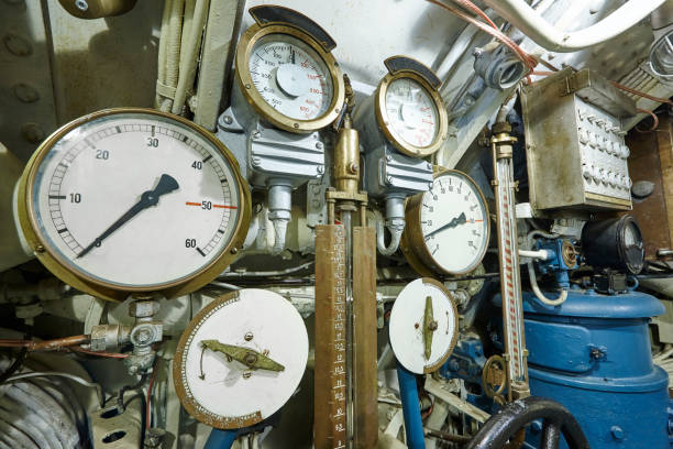 istock Antique manometers measuring instruments with control valves. Submarine equipment. 910363860