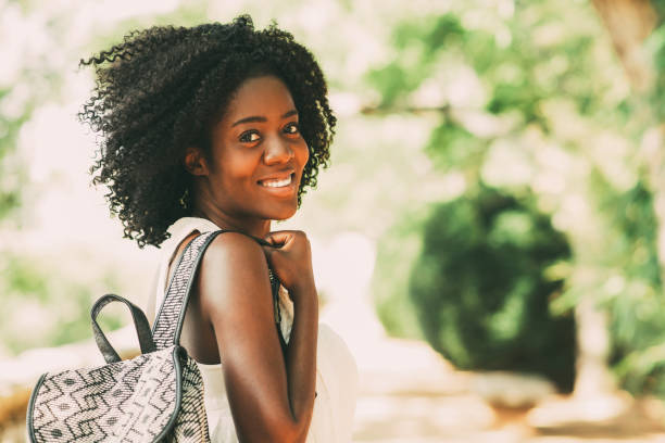 istock Happy Pretty Black Girl Walking in Park 910366452