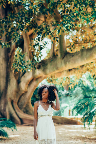 istock Pensive Black Woman Walking in Park 910366466