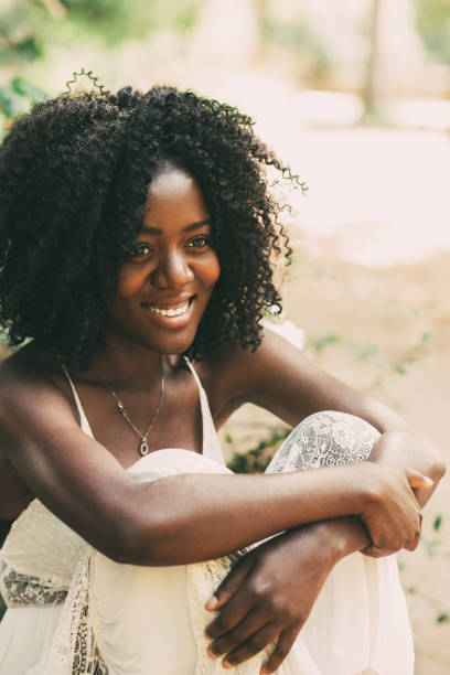 istock Smiling Young Black Woman Relaxing in Park 910366480