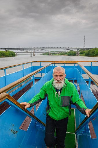 Portrait Senior Man with White Beard on a journey through the Russian rivers,Oka