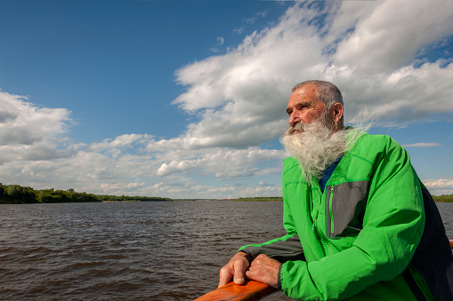 Portrait Senior Man with White Beard on a journey through the Russian rivers,Oka