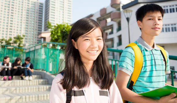 istock Teenage Students standing together at campus 910376790