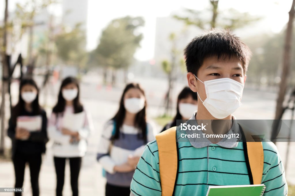 teenagers student wearing mouth mask against smog in city Asia Stock Photo