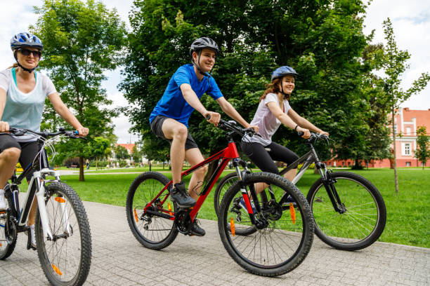 istock Urban biking- three people riding bikes in city 910382886