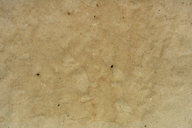 istock Crumled brown paper background. Texture concept. 910384450
