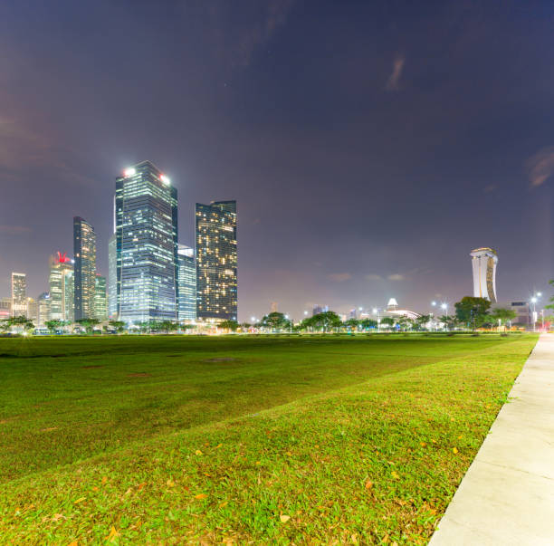 istock green grass land near modern buildings 910384706
