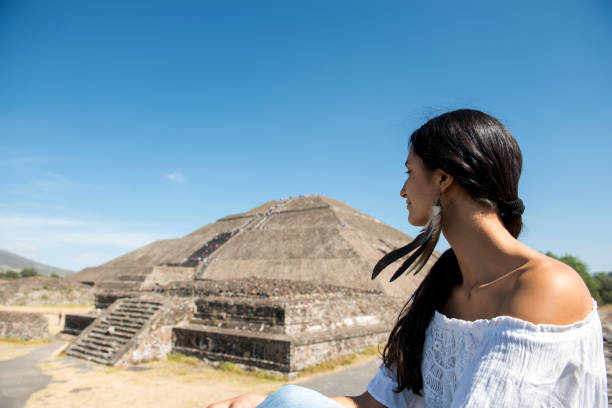 istock Woman looking at the Mexican pyramides. 910394696