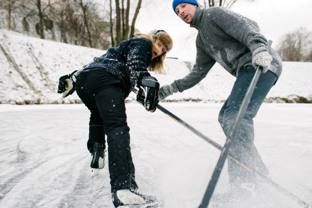 istock Two friends playing hockey 910395710