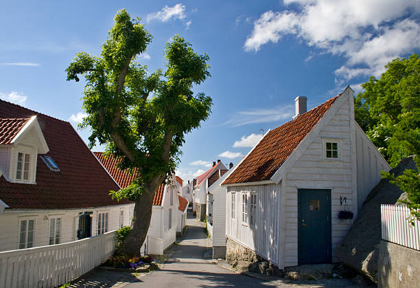 Old wooden houses in the city of Skudeneshavn, Norway. stock photo