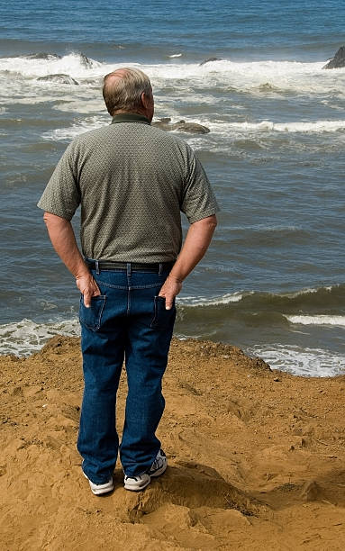 istock Older Man Looking Out at the Sea 91040742