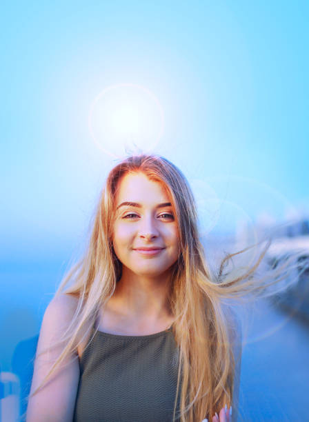 Pretty teenage girl looking into camera