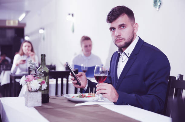 istock Man is dinnering in luxury restaurante alone 910408006