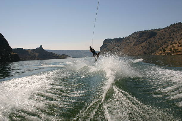 salta - wakeboarding nautical vessel wake jumping foto e immagini stock