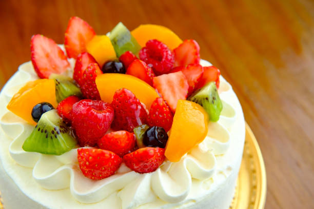 istock Cake with exotic fruits over wooden background 910410840