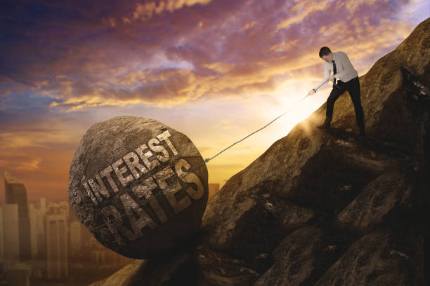 istock European businessman pulling text of interest rates 910411148