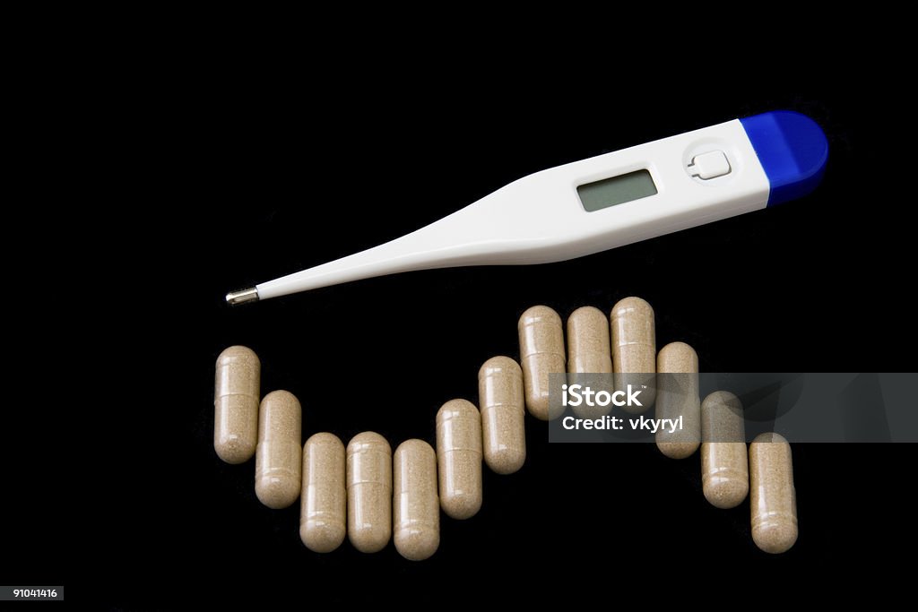 Thermometer and pills.  Accuracy Stock Photo