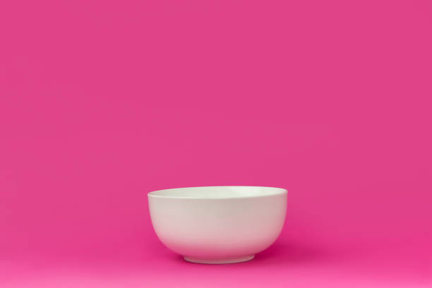 istock close-up view of single empty white bowl ready for breakfast isolated on pink 910420358