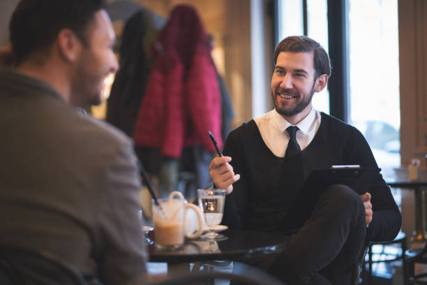 istock Young businesspeople working in restaurant 910421696