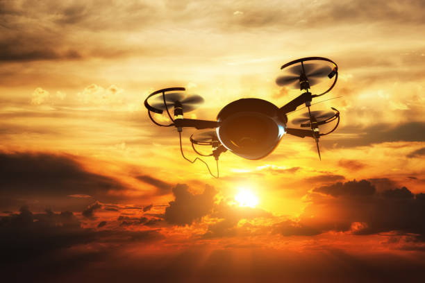 istock Drone flying at sunset. Sun shining on dramatic sky. 910421868