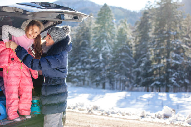 istock Mother dressing up her Daughter before going to have Fun outdoors 910421908