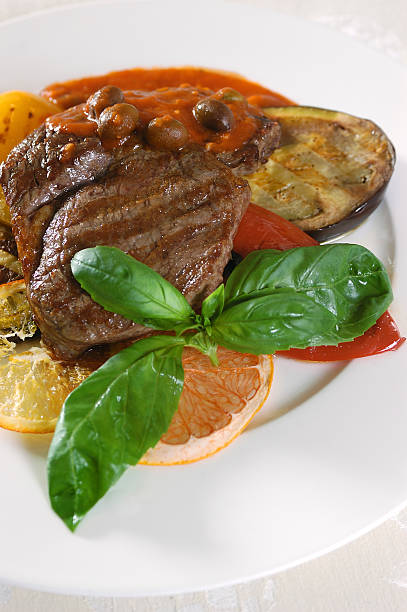 istock  peace of fried meat with vegetables and lemon 91042333