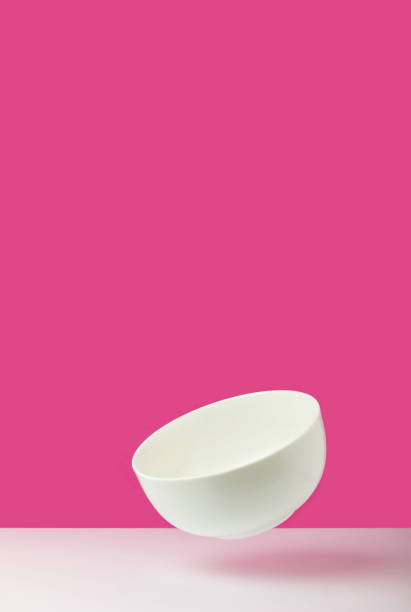 istock close-up view of empty white bowl on pink 910423478
