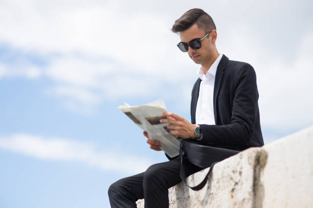 istock Concentrated businessman reading last news 910423600