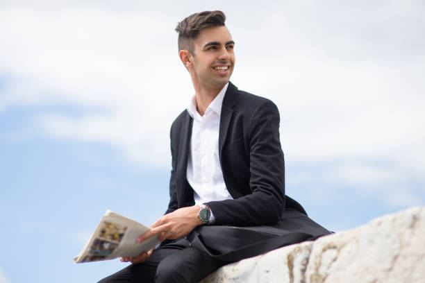 istock Smiling young man planning business strategy 910423646